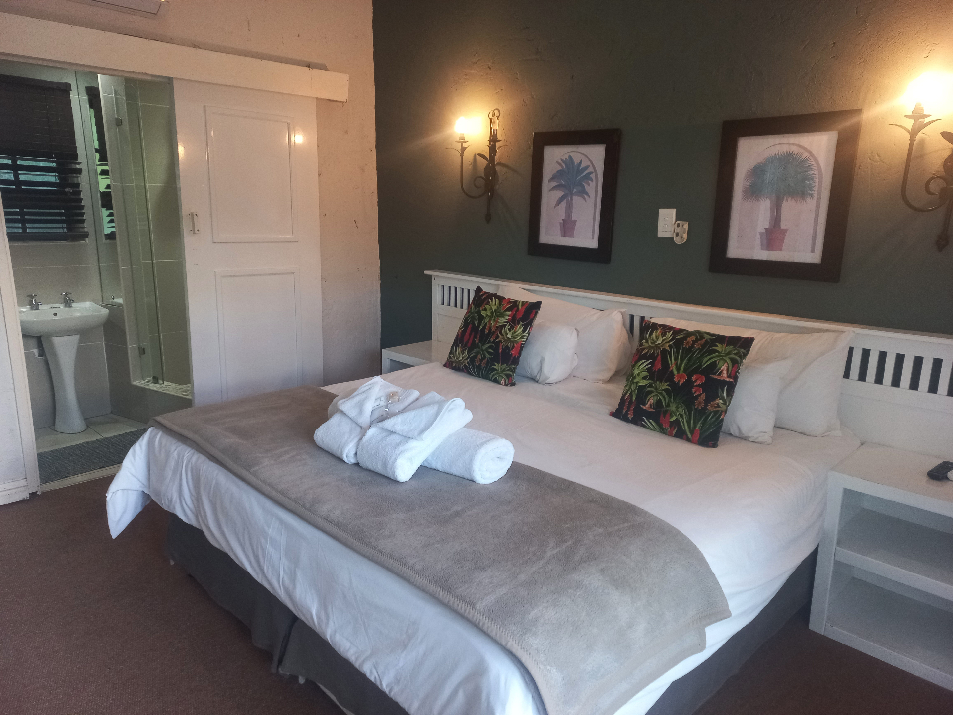 Mirelli room view showing the bed and bathroom entrance.
